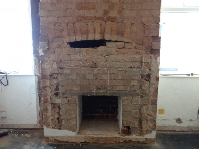 Exposed chimney breast in a Victorian house